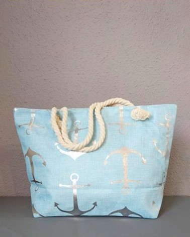 Bolso de playa azul celeste con anclas metálicas y asas de cuerda gruesa