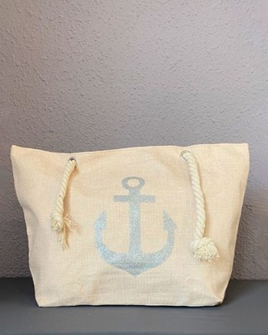 Bolso de playa beige claro con ancla plateada y asas de cuerda