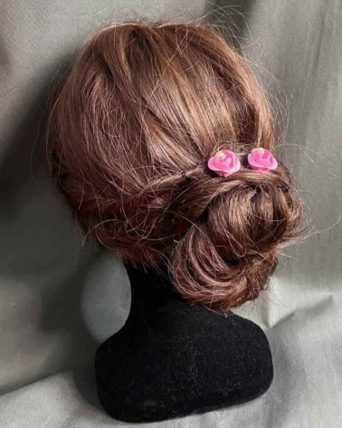 Horquillas florales con rosas fucsias y brillo central