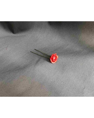 Horquilla floral roja con cristal central brillante