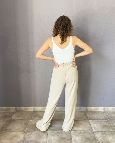 Pantalón fluido beige con cintura fruncida y cordón