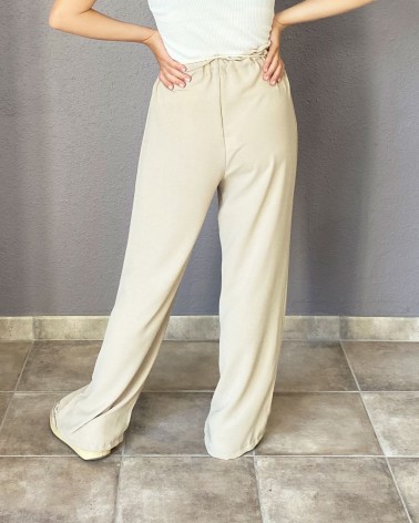 Pantalón fluido beige con cintura fruncida y cordón
