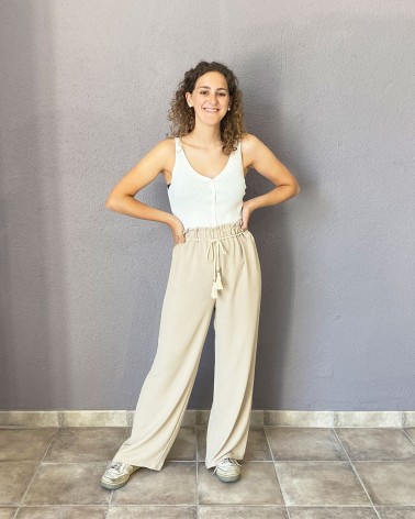 Pantalón fluido beige con cintura fruncida y cordón